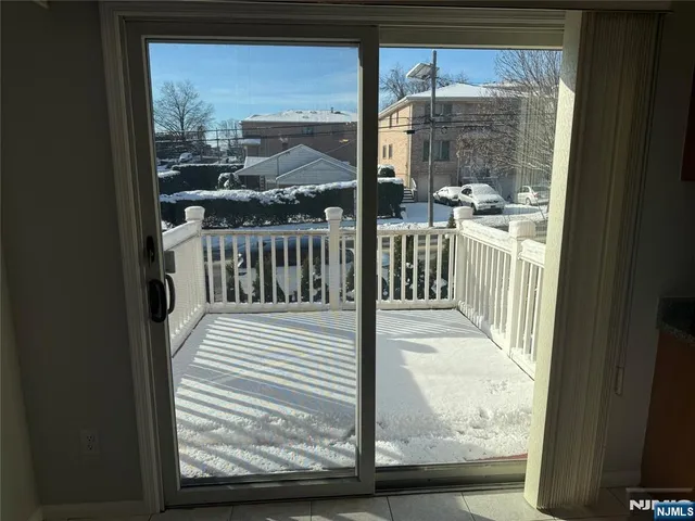 a view of a balcony with wooden floor