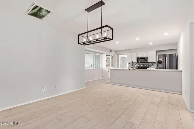 a view of a kitchen and a window