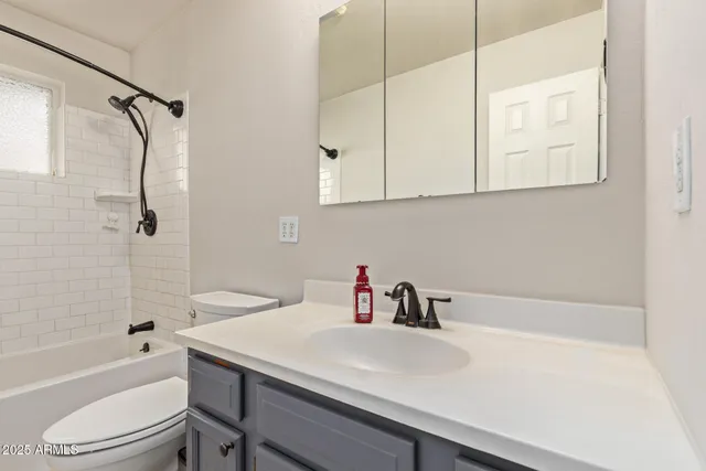 a bathroom with a sink a toilet and a bathtub