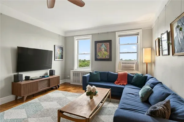 a living room with furniture and a flat screen tv
