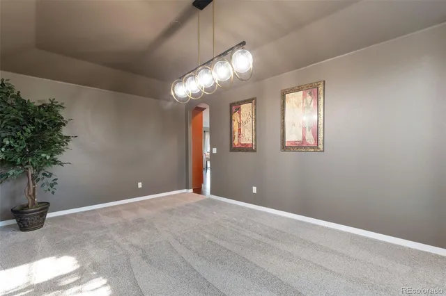 a view of an empty room with a potted plant