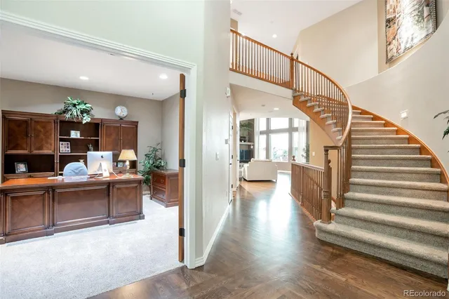 a view of entryway livingroom and hall with wooden floor