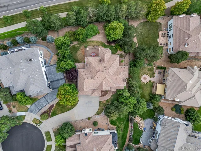 an aerial view of a house with outdoor space