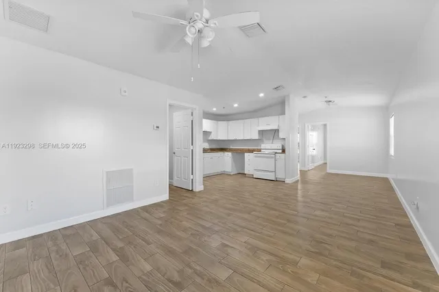 a view of kitchen with wooden floor