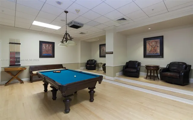 a living room with furniture a table and a flat screen tv