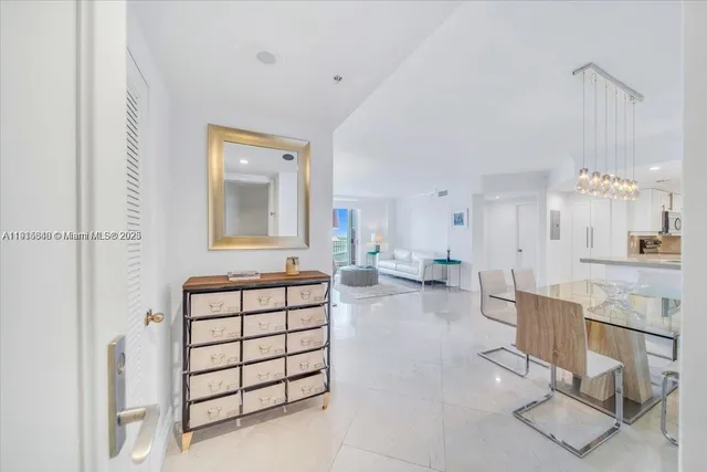 a spacious en suite bathroom with a double vanity sink mirror and bathtub