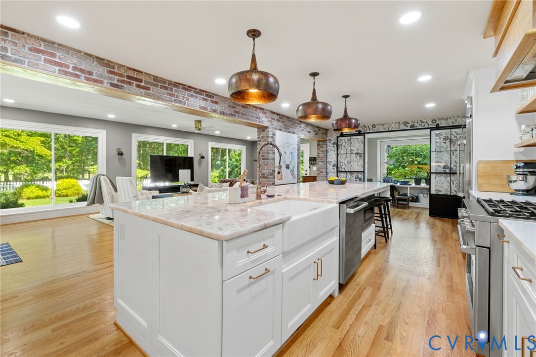 2360 Castlebridge Road Midlothian, VA 23113 - Photo 13 of 50 a kitchen with lots of counter top space and wooden floor