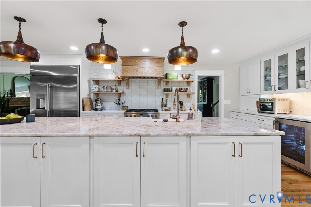 2360 Castlebridge Road Midlothian, VA 23113 - Photo 14 of 50 a kitchen with stainless steel appliances granite countertop a sink a stove and a wooden floors