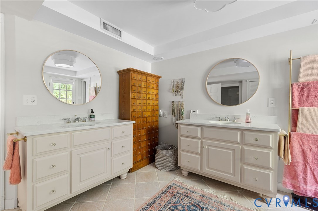 2360 Castlebridge Road Midlothian, VA 23113 - Photo 24 of 50 a bathroom with a double vanity sink and a mirror