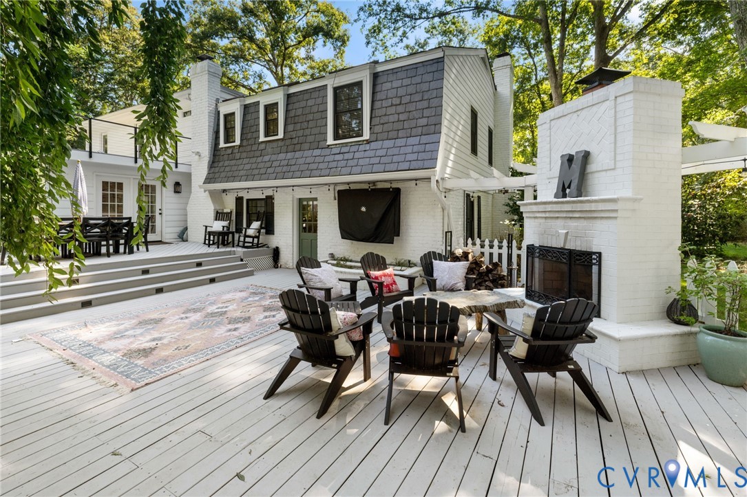 2360 Castlebridge Road Midlothian, VA 23113 - Photo 39 of 50 a view of a patio with dining table and chairs with wooden floor and fence