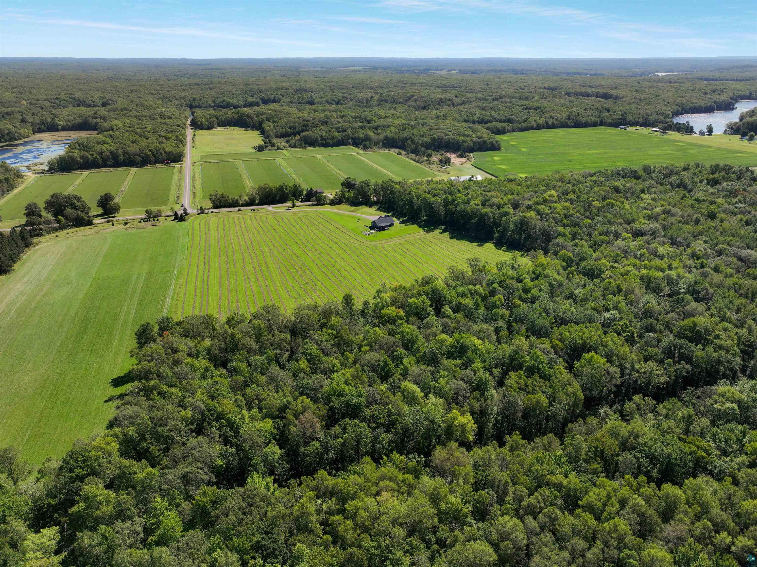 N3685 Fenander Road Spooner, WI 54801 - Photo 11 of 38 Drone / aerial view with a water view and a rural view