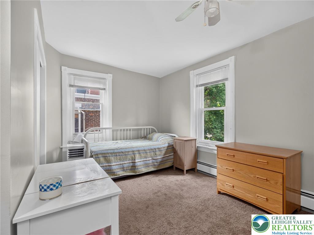 425 Ridge Street Emmaus, PA 18049 - Photo 20 of 27 A well-lit bedroom with soft carpeting and ample window light for comfort.