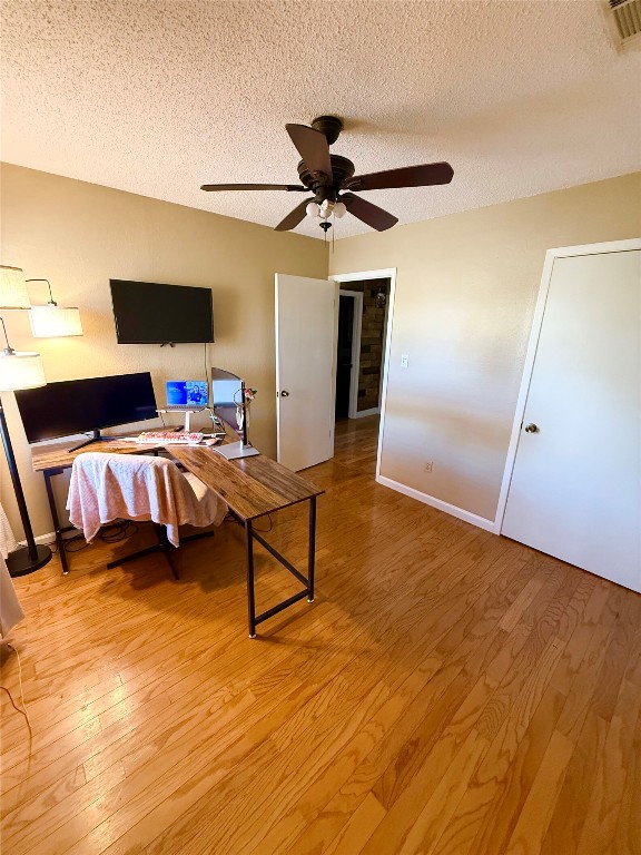 211 Rabbit Hollow Lane Georgetown, TX 78626 - Photo 19 of 32 2nd bedroom with wood flooring and ceiling fan