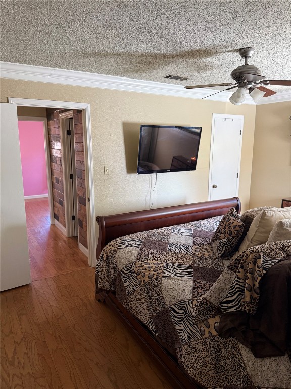 211 Rabbit Hollow Lane Georgetown, TX 78626 - Photo 23 of 34 a bedroom with a bed and a flat screen tv