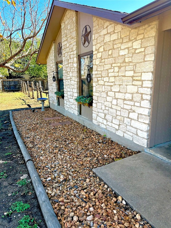 211 Rabbit Hollow Lane Georgetown, TX 78626 - Photo 4 of 32 View of side of property featuring stone siding.