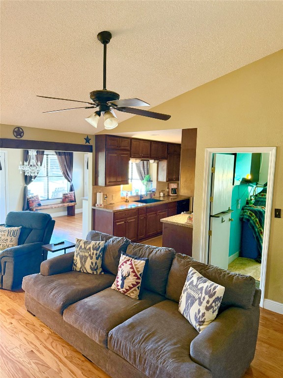 211 Rabbit Hollow Lane Georgetown, TX 78626 - Photo 7 of 32 Living room with light wood-style floors, a textured ceiling, and ceiling fan