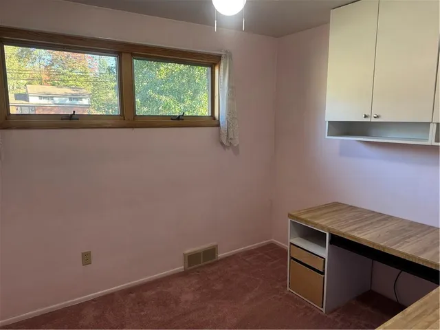 a room with storage and window