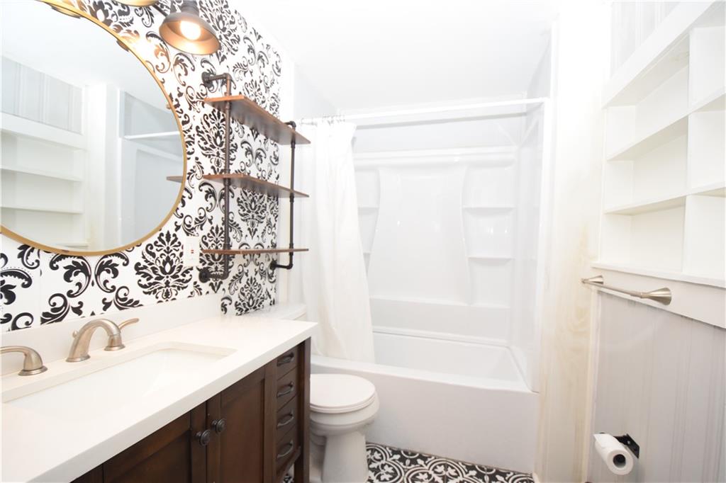 3116 Jackson Street Atlanta, GA 30354 - Photo 13 of 21 a bathroom with a sink toilet and shower