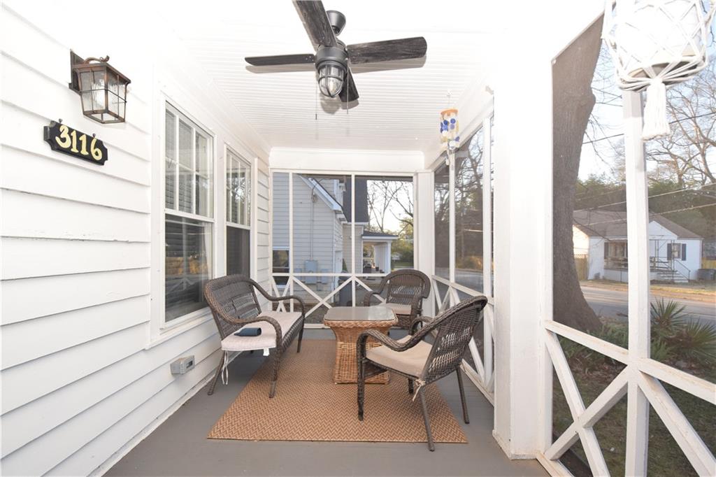 3116 Jackson Street Atlanta, GA 30354 - Photo 17 of 21 a dining room with furniture and a ceiling fan