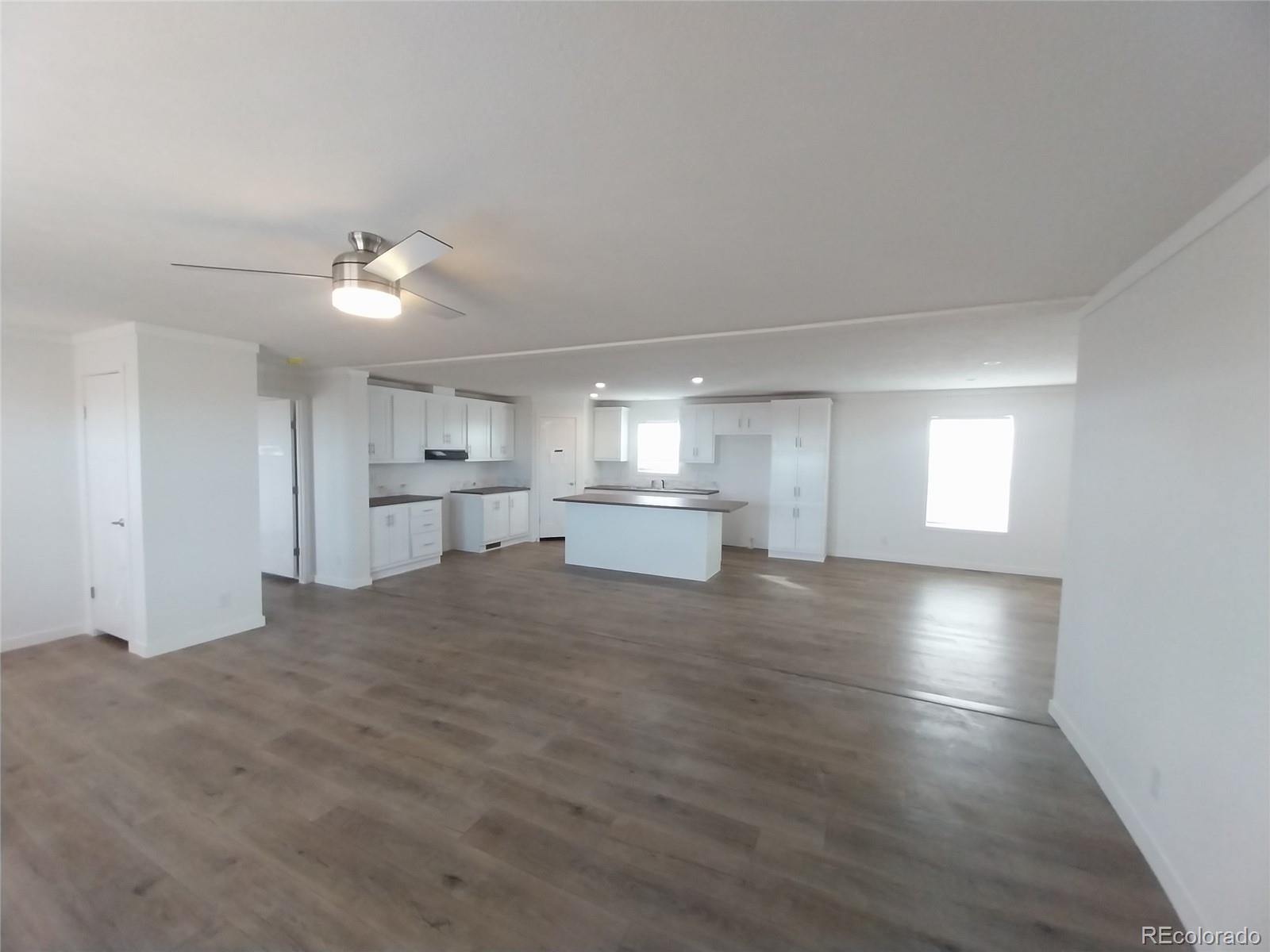 898 North Ramah Highway Yoder, CO 80864 - Photo 11 of 18 a view of a kitchen and empty room with windows