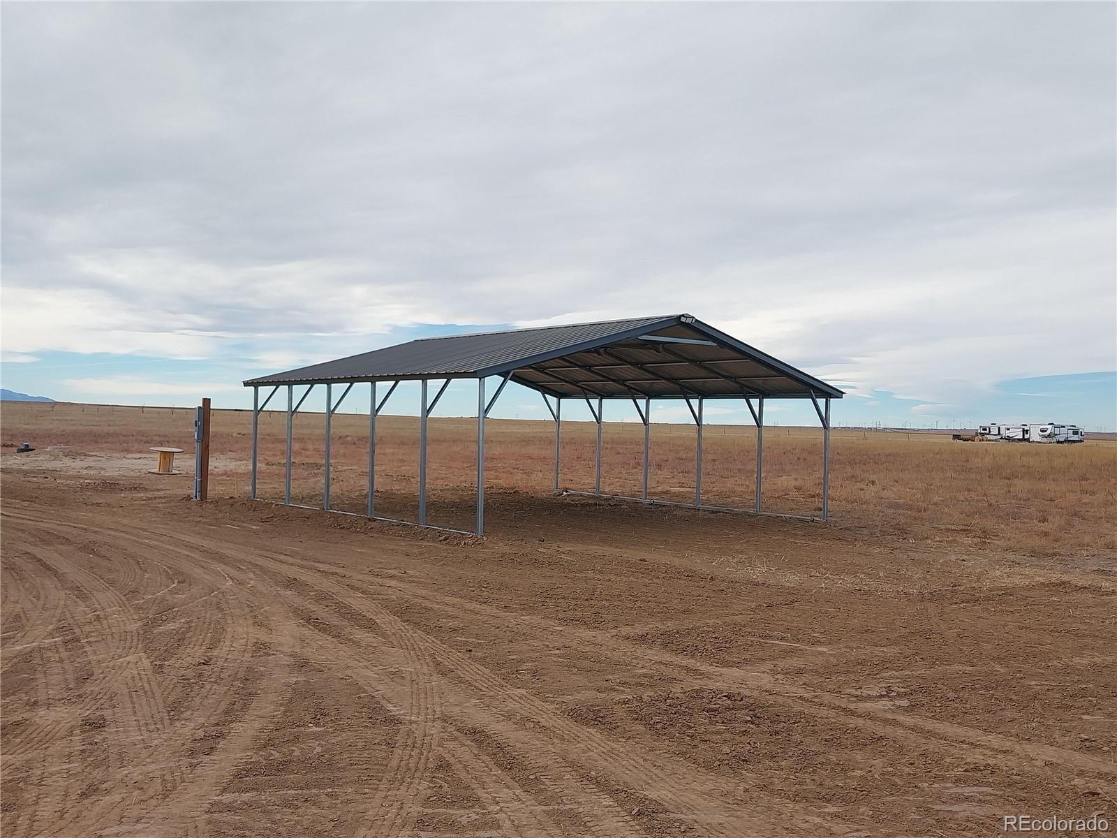 898 North Ramah Highway Yoder, CO 80864 - Photo 2 of 18 a view of swimming pool with outdoor seating