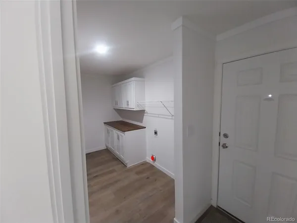 a view of kitchen and front door
