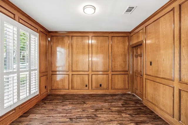 a view of a refrigerator in kitchen and wooden floor