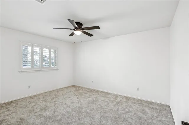 a view of a big room with carpet