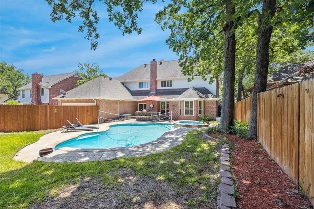 a view of a backyard with table and chairs and a slide