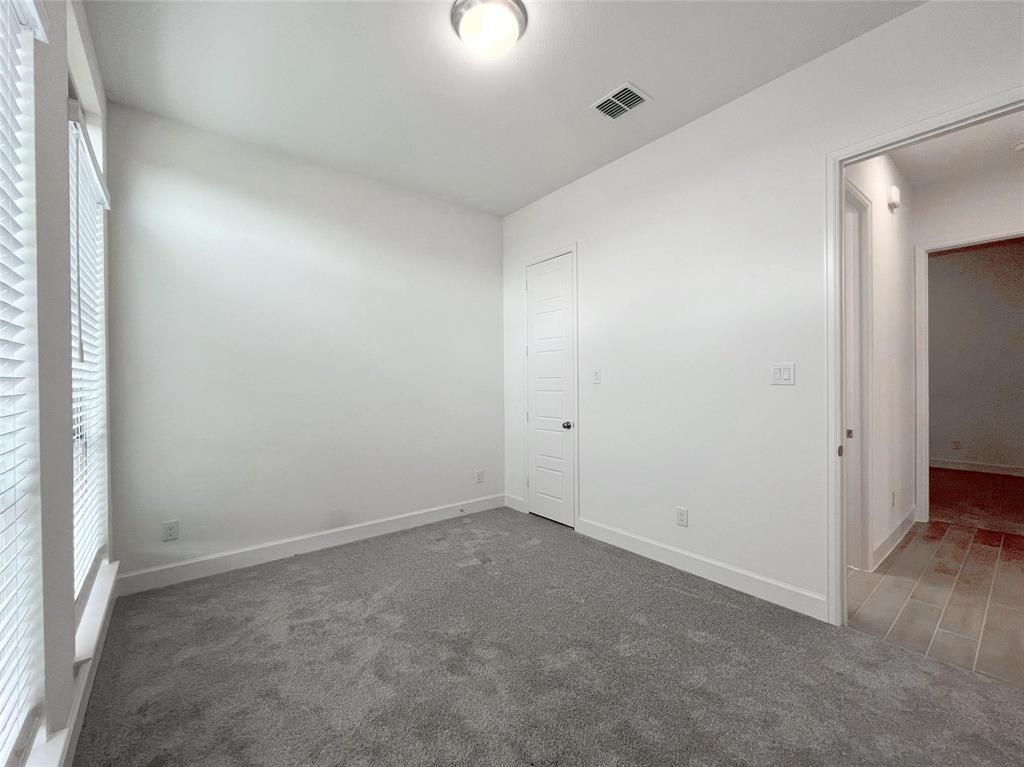 4315 Hudson Street Fate, TX 75087 - Photo 11 of 15 an empty room with a natural light