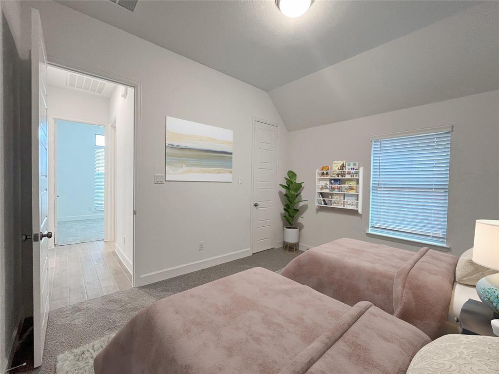 4315 Hudson Street Fate, TX 75087 - Photo 12 of 15 a bedroom with a bed furniture and window