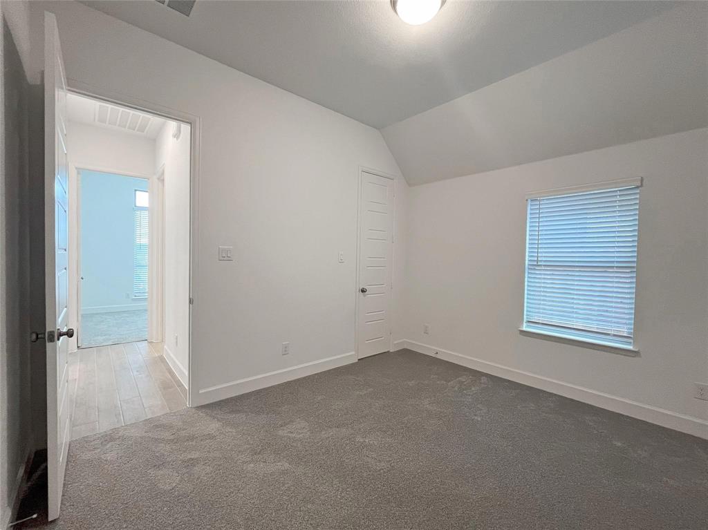4315 Hudson Street Fate, TX 75087 - Photo 13 of 15 an empty room with windows