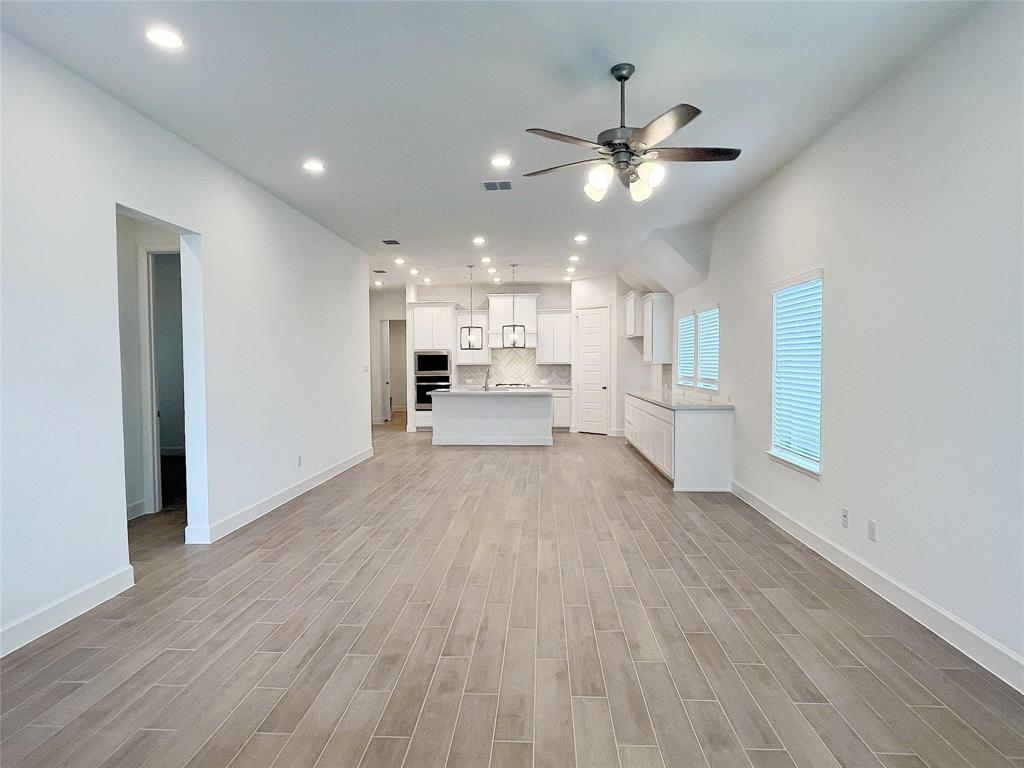 4315 Hudson Street Fate, TX 75087 - Photo 3 of 15 a view of a kitchen with a sink a refrigerator and window