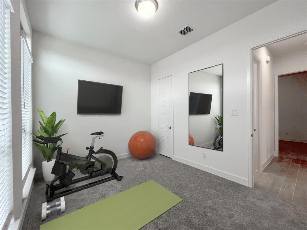 4315 Hudson Street Fate, TX 75087 - Photo 10 of 15 a room with a flat screen tv and a potted plant