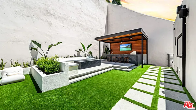 a backyard of a house with seating space