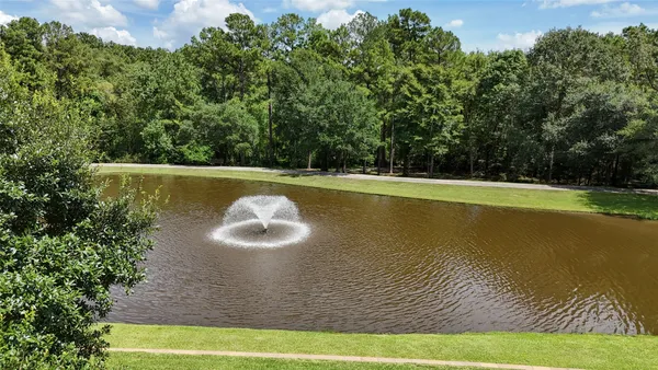 a view of a lake with a yard
