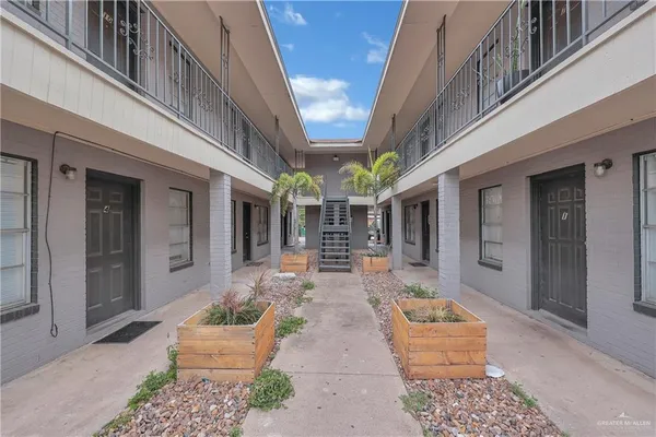 a front view of a house with outdoor seating