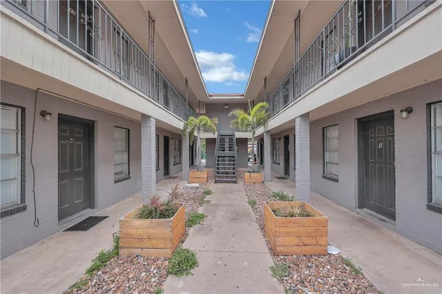 a front view of a house with outdoor seating