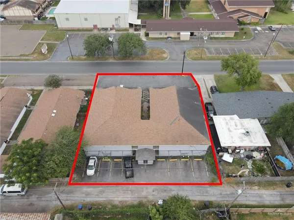 an aerial view of a house with swimming pool