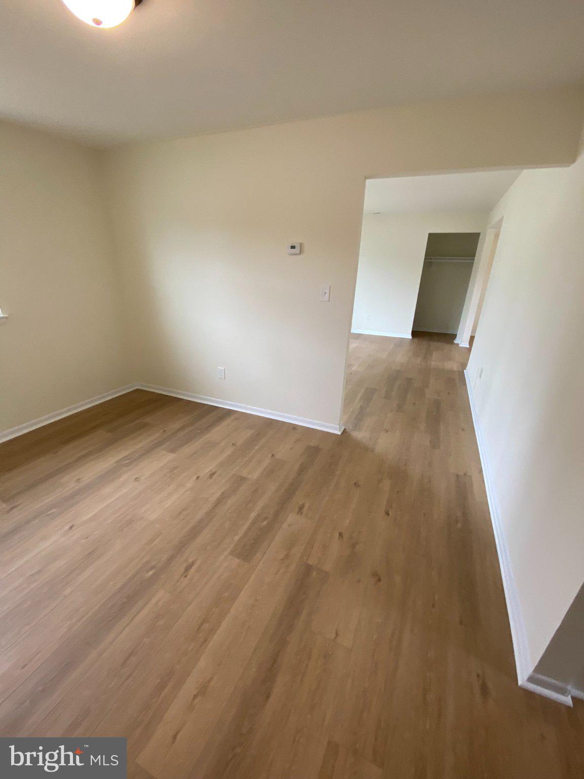 7707 Queens Road Pasadena, MD 21122 - Photo 13 of 19 Spacious, light-filled living area.