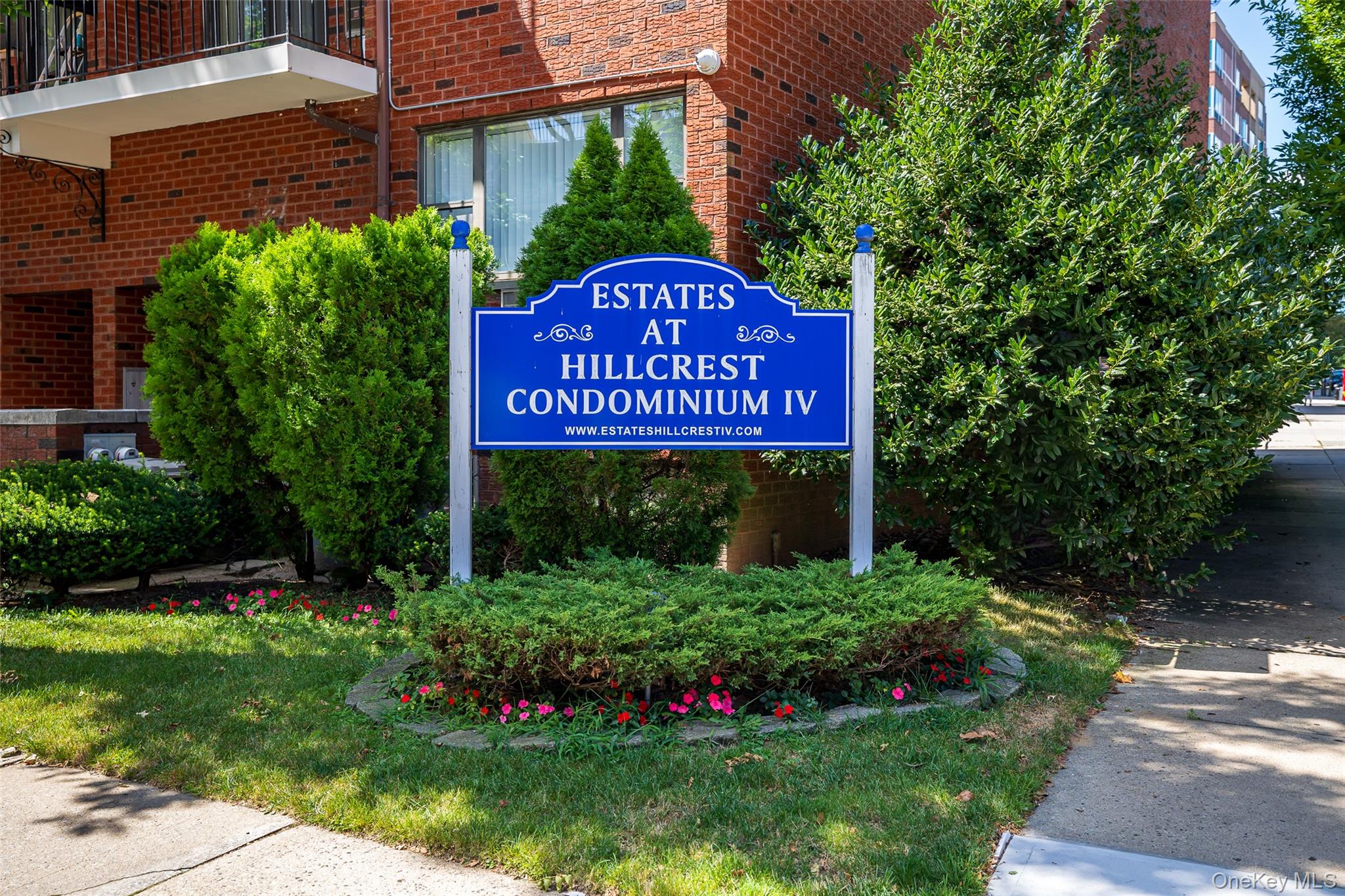 a sign broad in front of flowers
