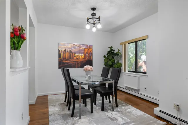 a view of a dining room with furniture and window