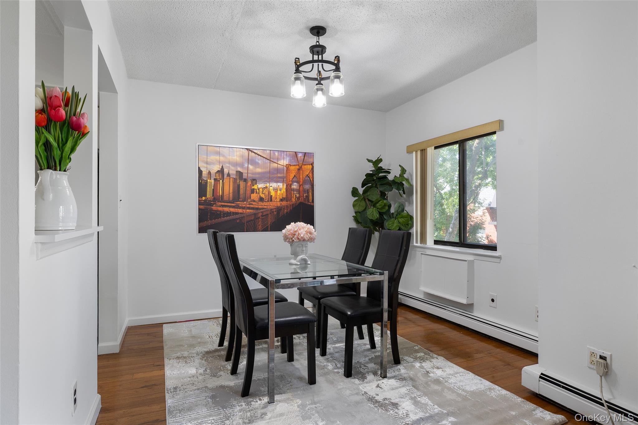 7111 Sutton Place, Unit 3 Queens, NY 11365 - Photo 11 of 27 a view of a dining room with furniture and window