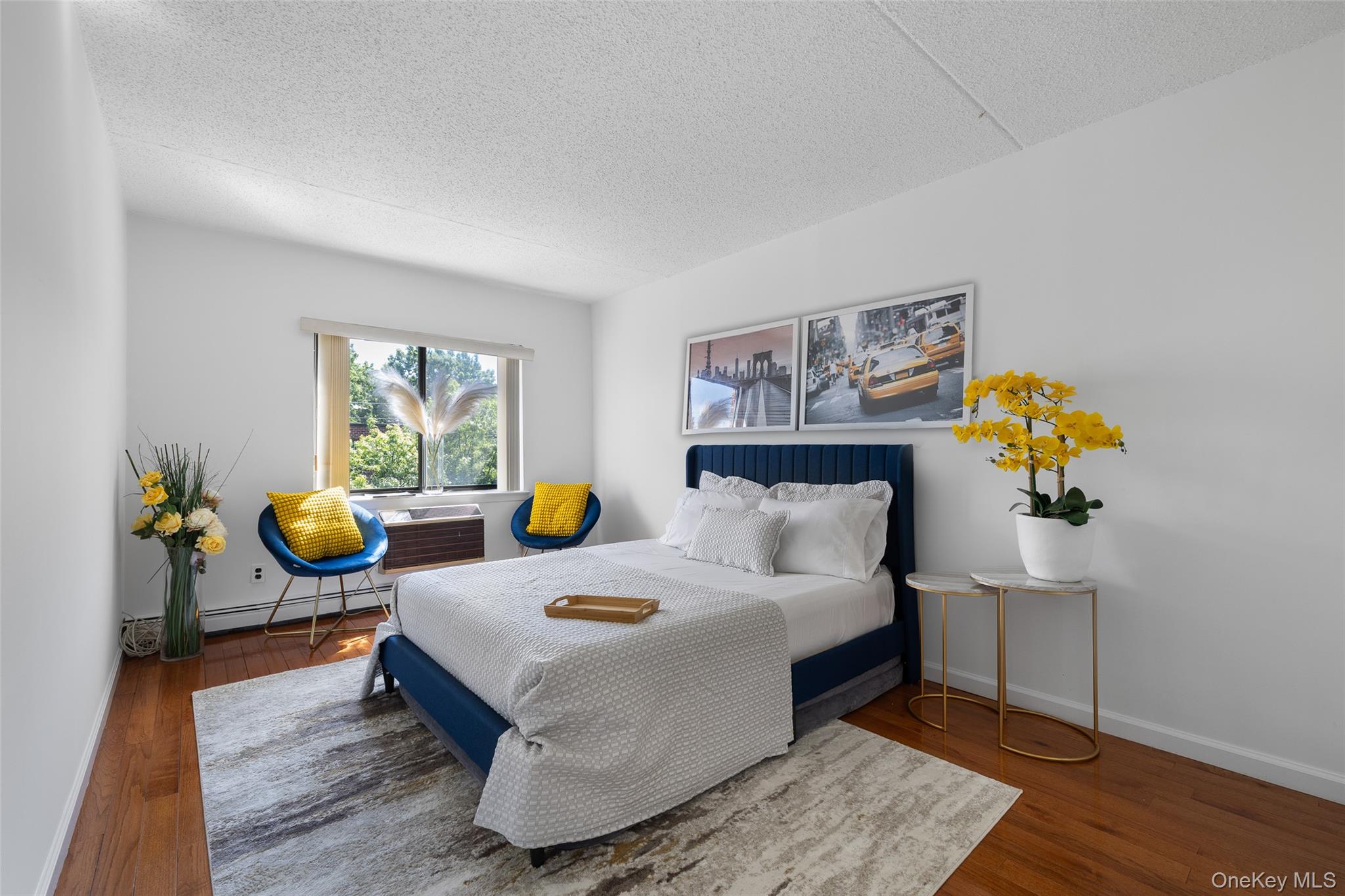 7111 Sutton Place, Unit 3 Queens, NY 11365 - Photo 15 of 27 a living room with furniture and wooden floor