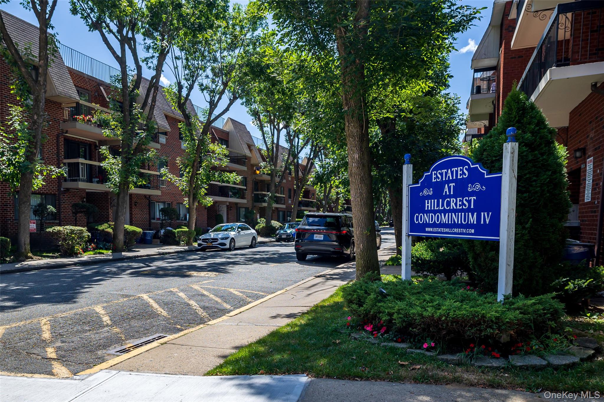 7111 Sutton Place, Unit 3 Queens, NY 11365 - Photo 2 of 27 a sign on the side of a building