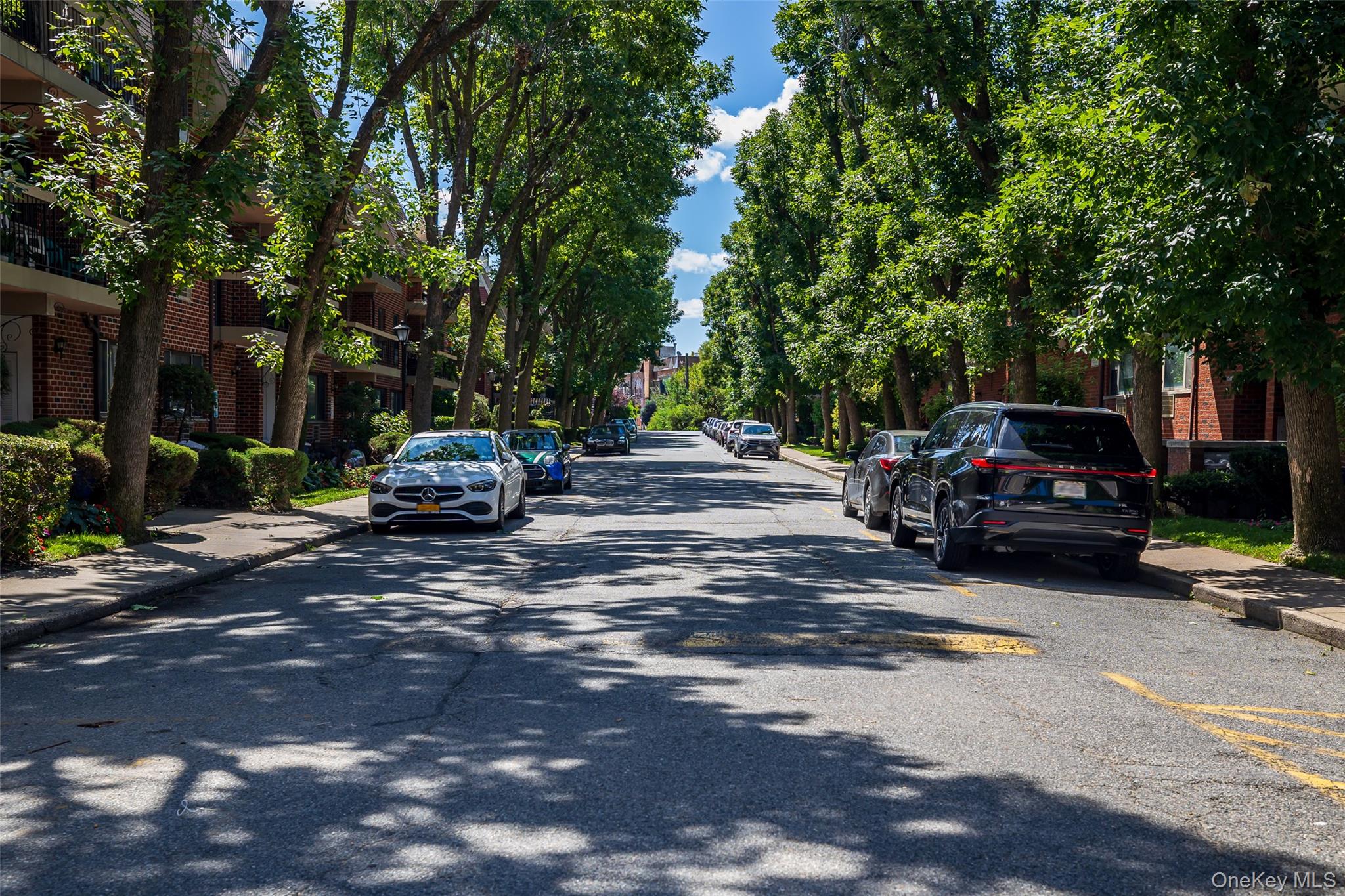 7111 Sutton Place, Unit 3 Queens, NY 11365 - Photo 21 of 27 a car parked on the side of a street