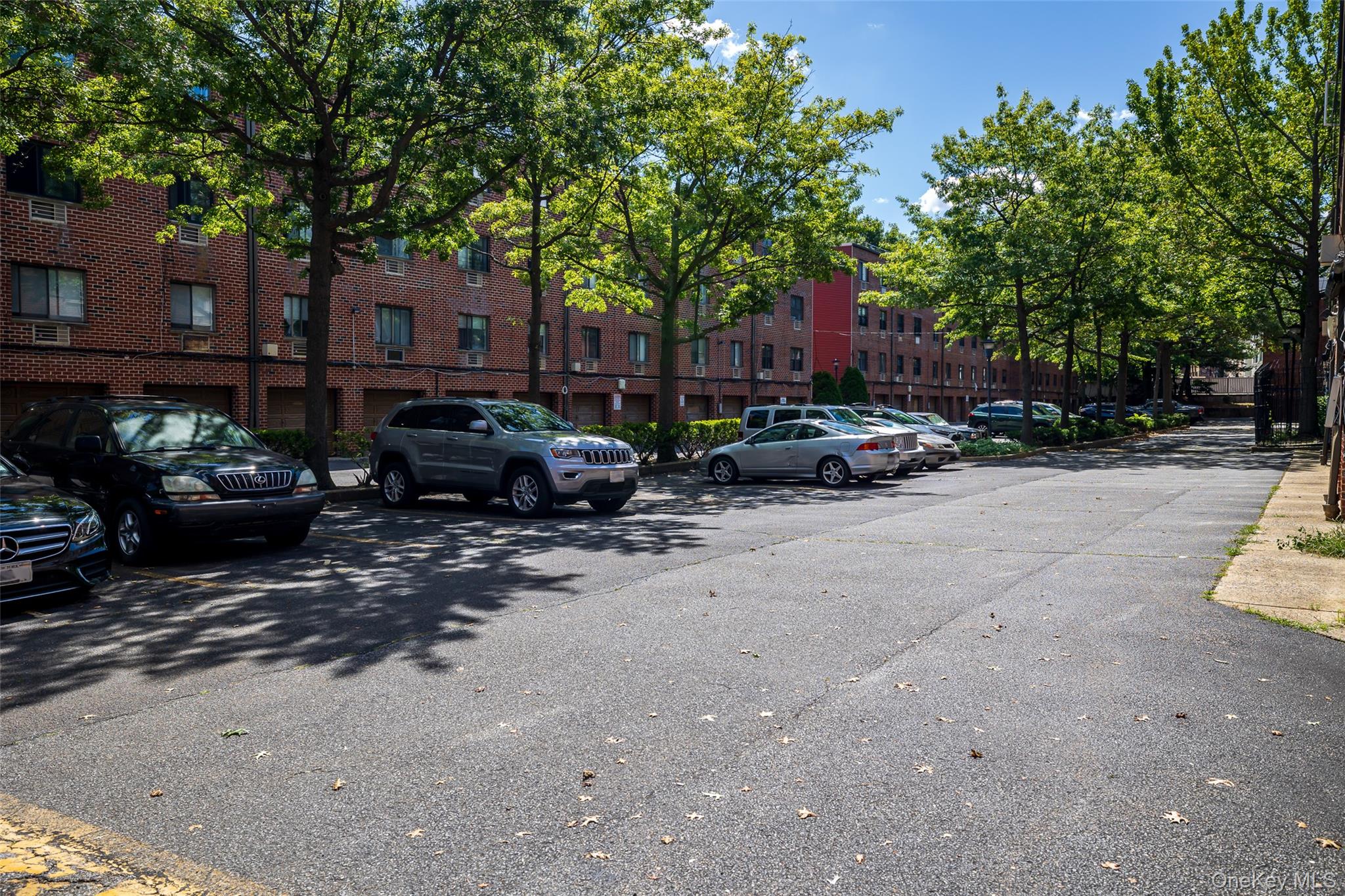 7111 Sutton Place, Unit 3 Queens, NY 11365 - Photo 22 of 27 a view of a street with cars
