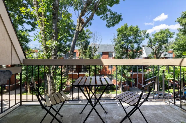 a view of a chairs and table in patio