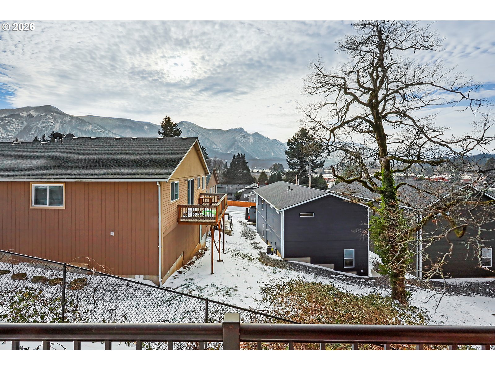 41 Lasher Street, Unit C4 Stevenson, WA 98648 - Photo 25 of 48 a view of a house next to a yard and mountain