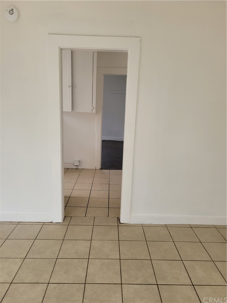 3077 Lemon Street Riverside, CA 92501 - Photo 11 of 20 an empty room with cabinet